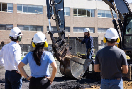construction workers with hardhats by excavator image created with Grok AI