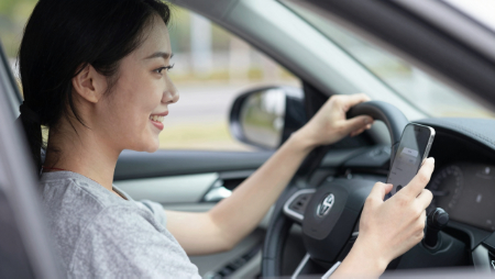woman smiling at her phone while driving generated with Z-Image
